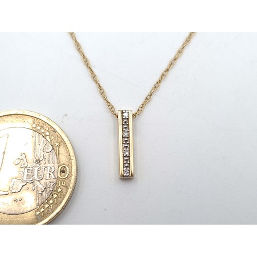 41 - A 9 carat Gold Diamond pendant and chain, featuring a channel cut intricate setting with cluster Dia... 