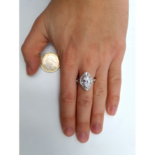 599 - A fine example of an unusual fine Moissanite Marquis gem stone ring. A striking modern design with a... 