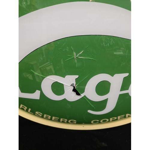 74 - A large convex commercial advertising sign for Carlsberg lager. Some damage as pictured.