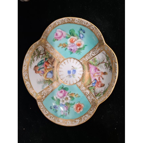 138 - An antique, beautiful Meissen porcelain cup and saucer set in the quatrefoil Helena Wolfsohn series.... 