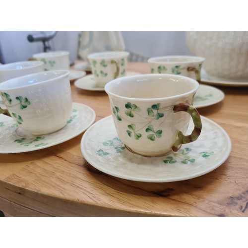 625 - Seventeen pieces of Belleek porcelain including tea cups, saucers, teapot, water jug and a dish in t... 