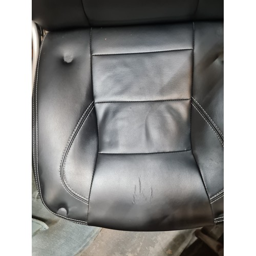 429 - A Songmics office black leather  gaming chair on a swivel base set on castors. With comfortable arm ... 