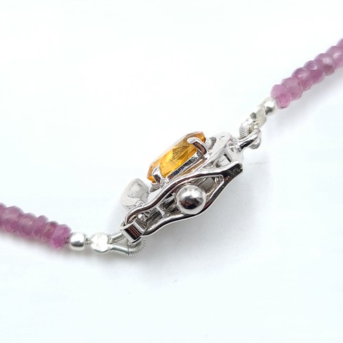 562 - A stunning graduated single strand Natural Ruby necklace, of 80 carats and set with a Citrine sterli... 