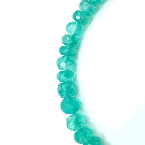 569 - An exquisite single strand graduated Emerald necklace, of 220 carats. Set in sterling silver with a ... 