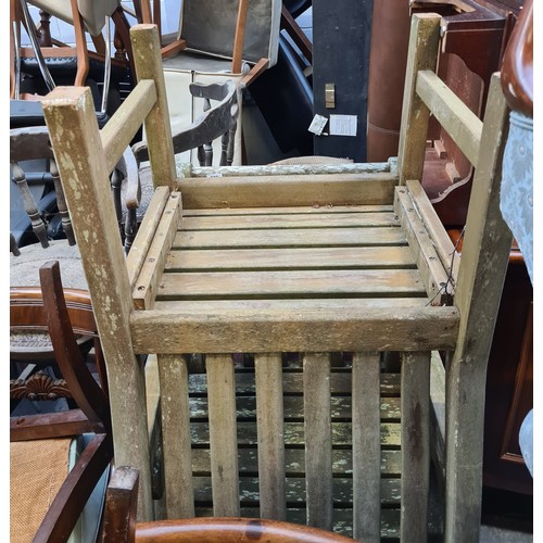 505 - A pair of slatted, wooden garden chairs. Both generous examples with strong frame.