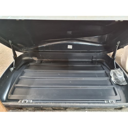 490 - A car roof cargo carrier for storage. Model is AUTO-XS 320. Accompanied by a pair of Thule branded r... 