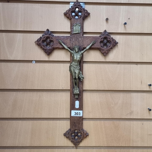 303 - A good quality large wooden wall crucifix with a brass figure of Jesus. Featuring beautiful pierced ... 