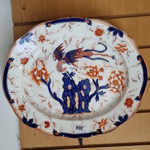304 - A large beautiful 19th century  porcelain Imari charger plate. Featuring floral design in navy blue ... 