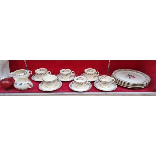 320 - Nineteen pieces of vintage Taylor Smith USA china dinner set including plates, tea cups, saucers, mi... 
