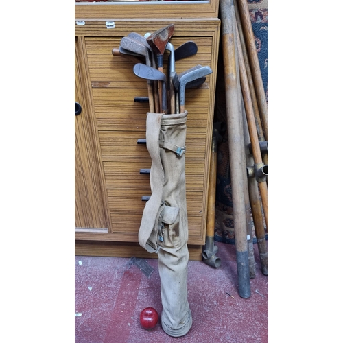 337 - Eleven antique hickory shafted golf clubs including irons, wedges and putters. Come with original pe... 
