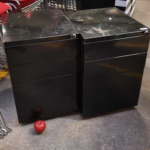 383 - A pair of filing cabinets with locks to front, each with three drawers, one large and two smaller to... 