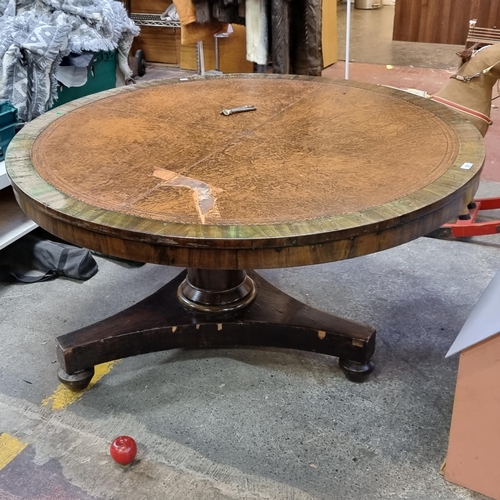 387 - A fabulous large antique round breakfast table with embossed leather top, columnar pedestal and trip... 