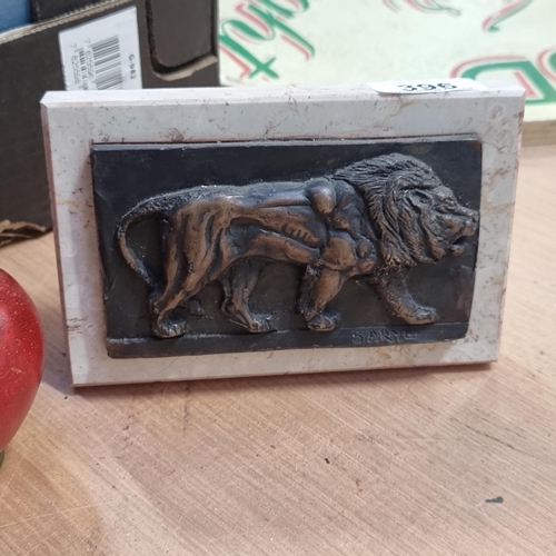 396 - A fantastic cast bronze plaque in the form of a lion in profile, mounted on a marble stand. Signed B... 
