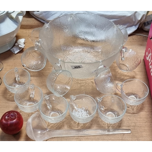 400 - A fantastic large glass punch bowl, accompanied by thirteen glasses with detachable hooks for displa... 