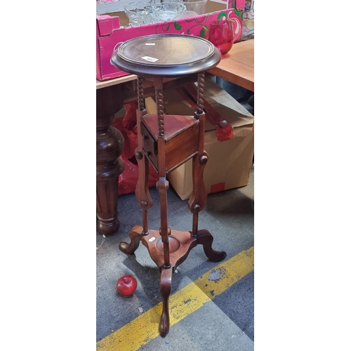402 - A charming tall plant stand with two neatly proportioned triangular drawers to front. Featuring barl... 
