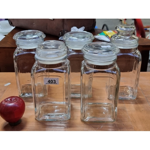 403 - Five glass storage jars, all with rubber sealed lids. Perfect for biscuits, cereals or anything you ... 