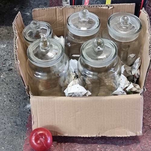 635 - Five large lidded glass jars perfect for storing dry food items.