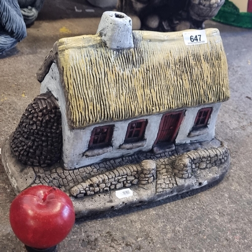 647 - A very charming garden ornament of a cosy, traditional thatched cottage. Hand painted in colourful s... 