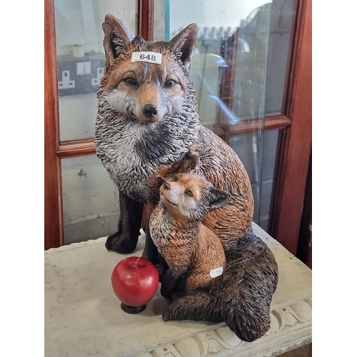 648 - A darling garden ornament in the form of a young fox cub snuggled against her mother. A very heavy, ... 