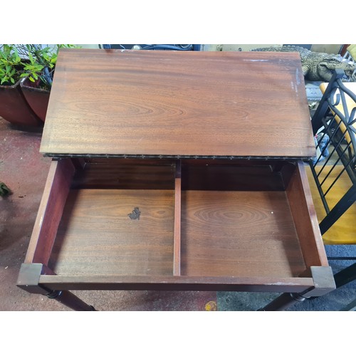 639 - A handsome sloped writing desk with green leather slope, pen rest and two good sized compartments in... 