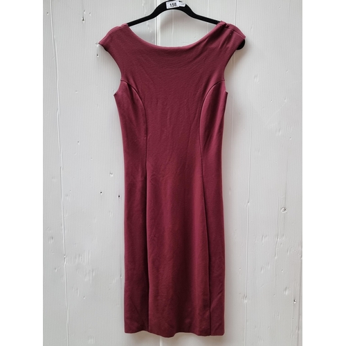 158 - A striking ladies dress in a rich shade of burgundy by designer Emporio Armani. Designed with an unu... 