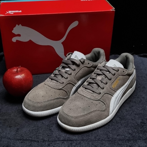 181 - A brand new pair of girl's trainers by PUMA. Designed in the ICRA series in steel-gray with genuine ... 