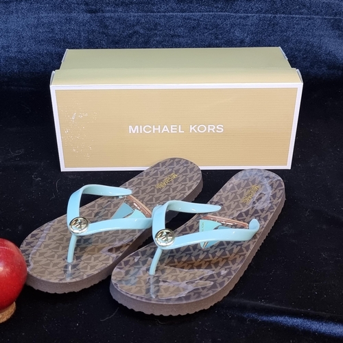 94 - A pair of brand new Michael Kors designer flip-flop sandals. Designed in a brown sole with ocean blu... 