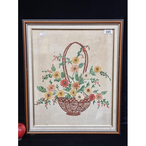 245 - A charming original vintage embroidery piece featuring a colourful display of flowers in a wicker ba... 