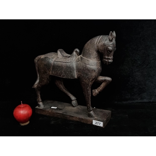 277 - A striking black Chinese  horse  figure, with wonderful composition to the posture. A great styling ... 