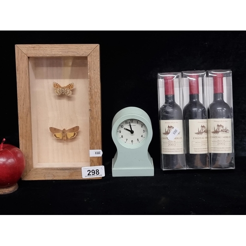 298 - A selection of five items to include three wine bottle openers and a Thomas Kent desk clock. Along w... 