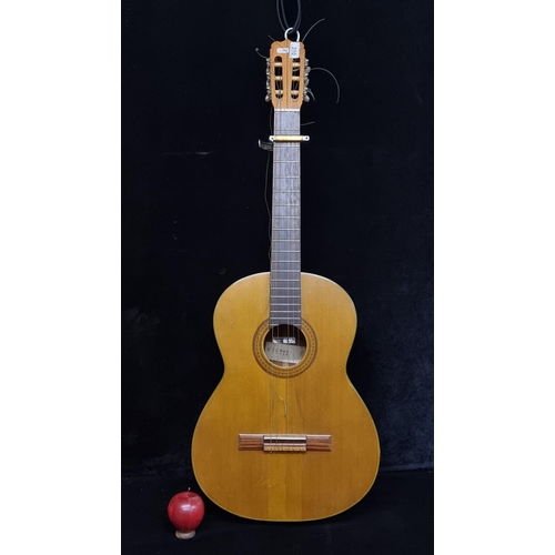 310 - A high quality classic Spanish guitar with string inlay to the head stock, brass housing around the ... 