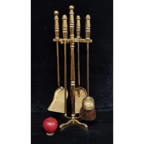 311 - A very heavy solid brass fireside companion stand, including two shovels and a hard bristle brush. l... 