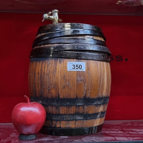 350 - A very charming antique wooden coopered barrel with metal banding and a decorative tap.