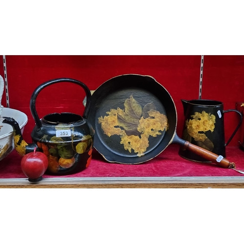 353 - Three pieces of antique Japanned serving ware including a cast iron pan, kettle and pitcher. All fea... 