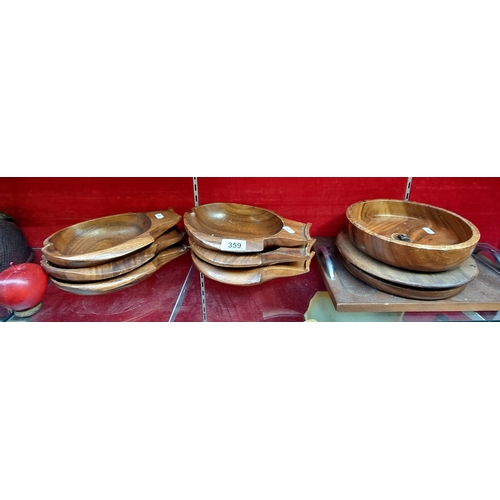 359 - A selection of eight high quality turned wooden servingware comprising of six fantastic hand carved ... 