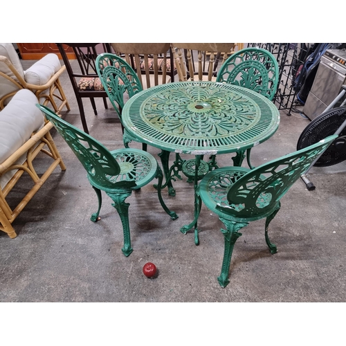 666 - Star lot : A stunning cast metal garden table with four matching chairs. Wonderfully ornate pieces w... 