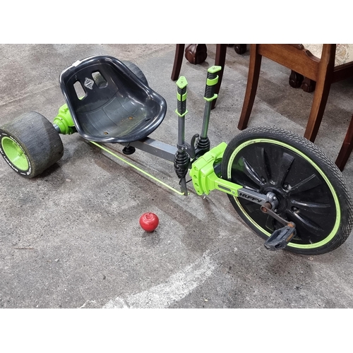 685 - A Huffy branded 'Green Machine' pedal bike for kids. Designed with dual stick steering with rear whe... 