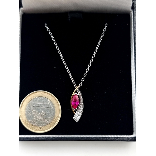 703 - An exquisite Ruby and gem set drop pendant and a sterling silver chain. Length of chain: 44cm. Prese... 