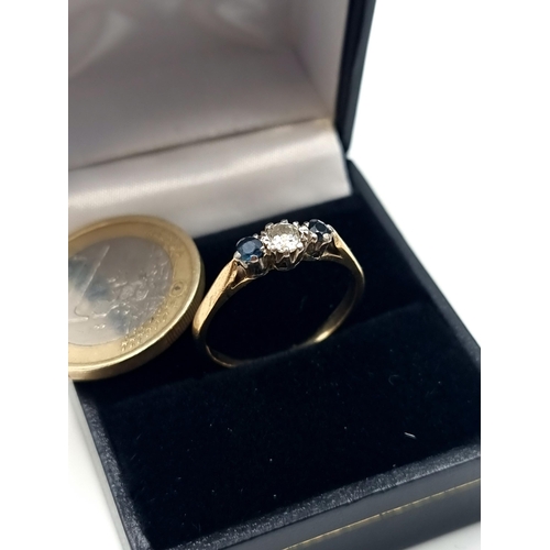 708 - Star lot : A 9 carat Gold Diamond and Sapphire three stone ring. The Diamond within this example has... 