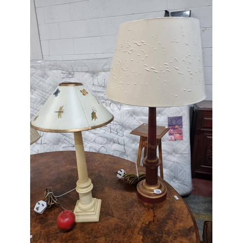 709 - Two nice table lights including a tall red pillar example with a cream shade.