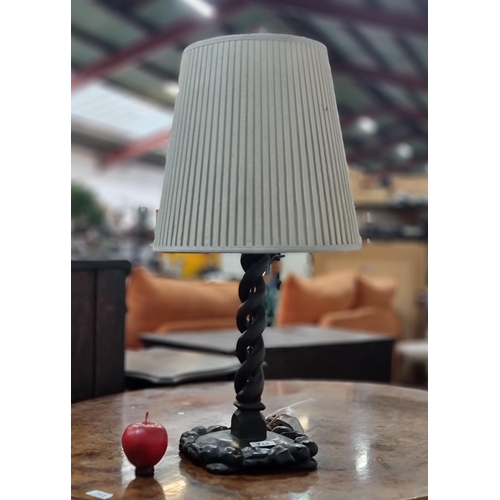 715 - A striking vintage table lamp crafted from a carved wooden base. Featuring an unusual open helix ste... 