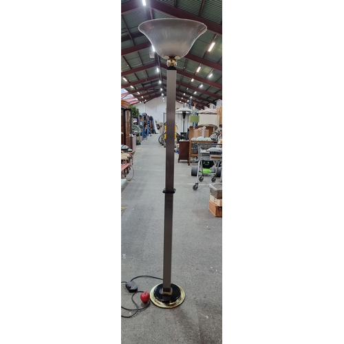 832 - A tall elegant floor standing lamp with brushed chrome stem and ceramic shade, fitted with a guilt b... 