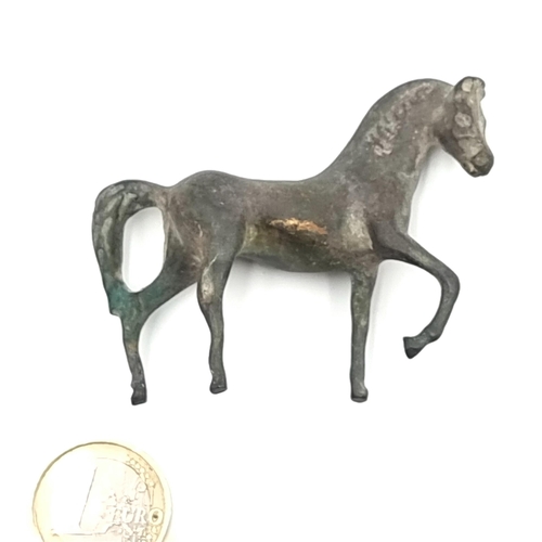 855 - Star lot : A neatly proportioned fabulous  bronze figure of a proud horse mid-trot. Weight: 78.51g. ... 