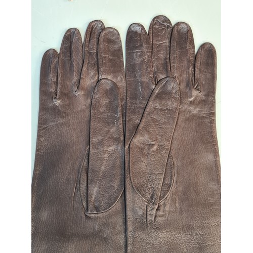 75 - A handsome pair of long Christian Dior genuine brown leather women's gloves, stamped to interior. Ve... 