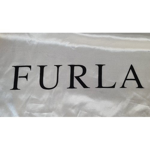 78 - A striking genuine leather ladies handbag by designer brand Furla. An elegant example in a ruby red ... 