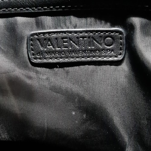 82 - A beautiful ladies handbag by designer brand Valentino. A stylish drawstring example in black with p... 