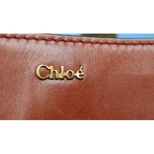 83 - Star Lot : A fabulous designer ladies handbag by Chloé brand. Designed in a scarlet red soft box cal... 