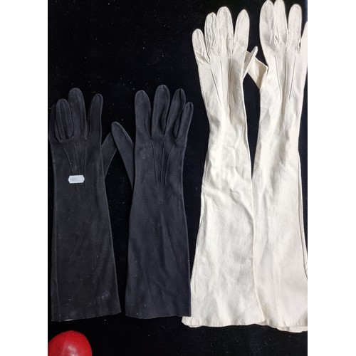 73 - Two lovely pairs of elbow length vintage women's gloves including a beautiful genuine leather white ... 