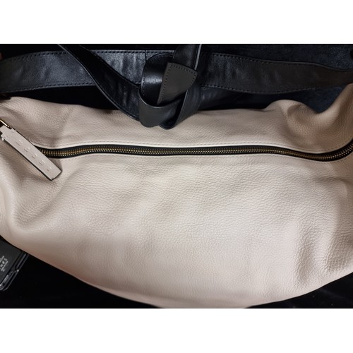 86 - Star Lot : A brand new ladies designer holdall handbag by Marni. Designed in a cream toned calf leat... 