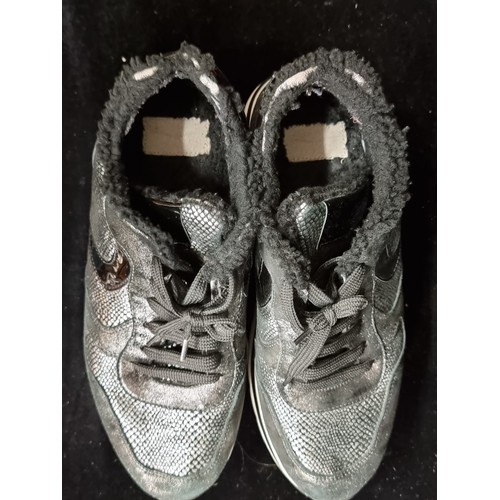 90 - A pair of designer ladies platform trainers by Voile Blanche. Designed in a metallic silver on black... 